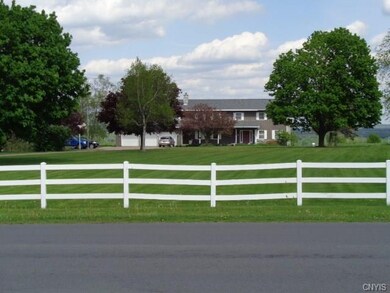 Large front yard with house that sits back off the