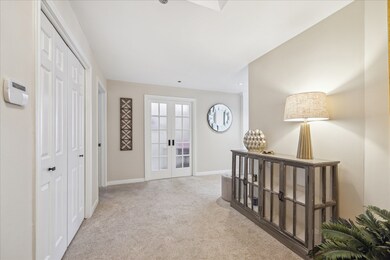 Large formal entry hall with guest closet.