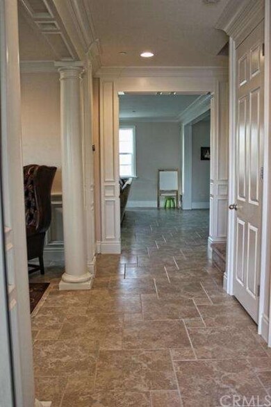 HALLWAY TO FORMAL LIVING RM ON THE LEFT & OPEN FAM