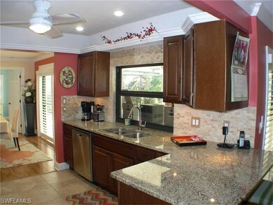 Photo of kitchen with breakfast bar.