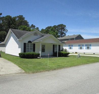 Single story home with a front lawn