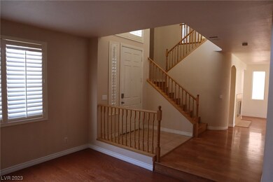 Foyer, staircase leading to bedrooms upstairs.