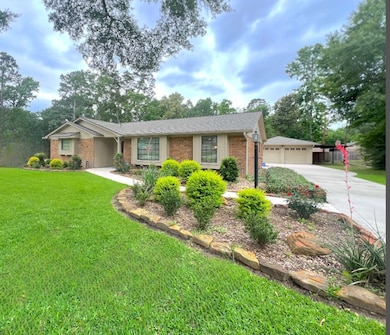 Ranch-style house featuring brick siding, a front