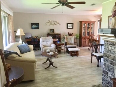 Pergo flooring & crown molding enhance this spacio