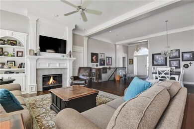 Cozy gas fireplace, extensive molding and built-in