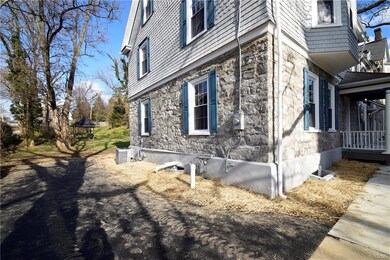 Side view of home showing off gazebo, AC unit and 