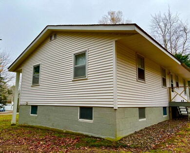 Exterior side of home facing woods