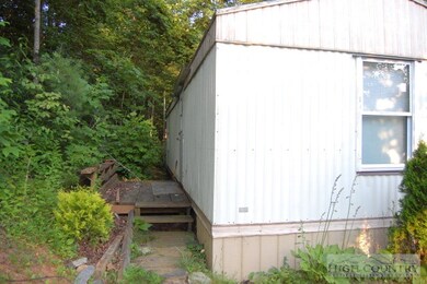 Back View: Wooded lot right down to the rear deck.