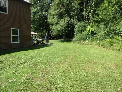 Side yard to back patio and where the swing set it