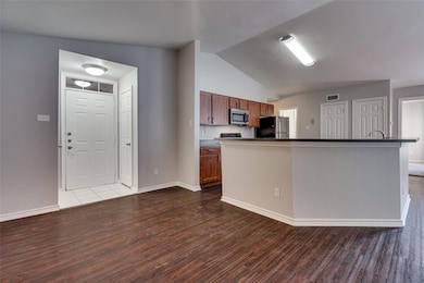 Kitchen featuring appliances with stainless steel