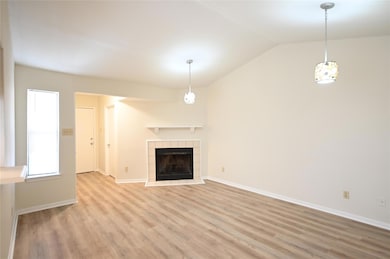 Unfurnished living room with light wood-style flo