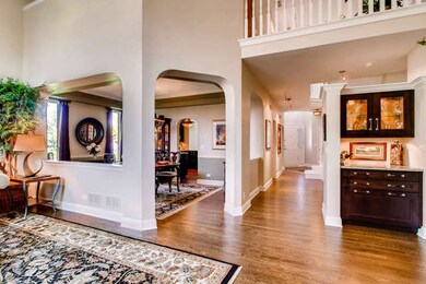 Living room looking into dining room and foyer.  N