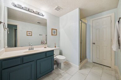 The first floor full bathroom with a walk in showe