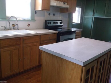 Kitchen has some updated cabinetry and includes st