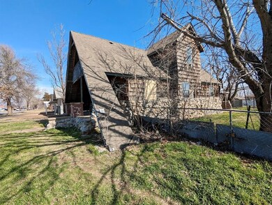 View of home's exterior with a yard