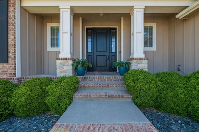 Charming front entry with maintenance free good looking black rock landscaping