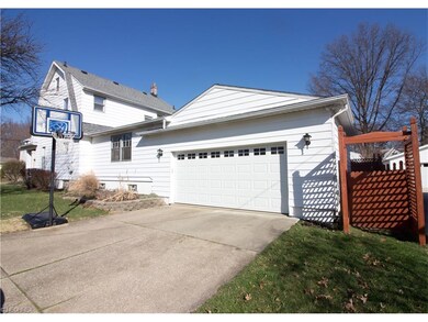 Two Car Attached Garage with walk-way into home. L