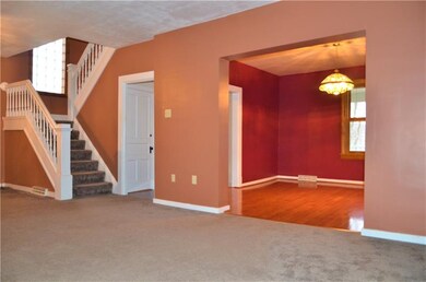 Living room looking into dining room and kitchen e