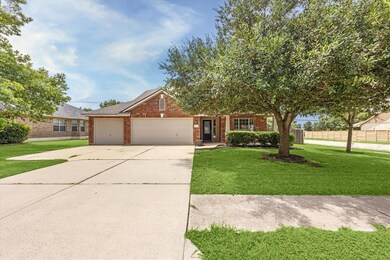 View of front of house with fence, driveway, a fr