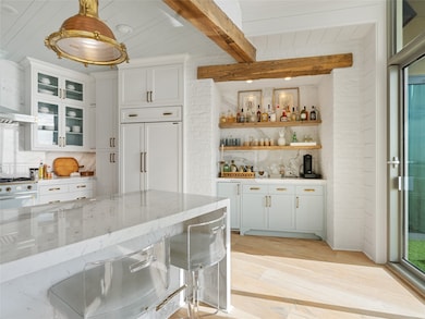 Coffee and spirits bar with ice maker.