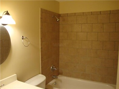 Renovated Bath with updated tile, vanity, and mirr