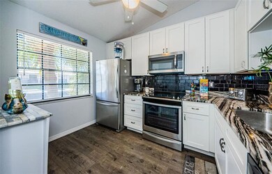 Light and Bright kitchen has all the bells and whistles. Granite countertops, subway tile backsplash, stainless-steel appliances.