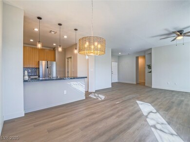 Kitchen featuring freestanding refrigerator, a cei