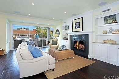 Great Room with fireplace and hickory floors opens