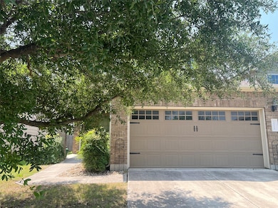 Garage featuring concrete driveway