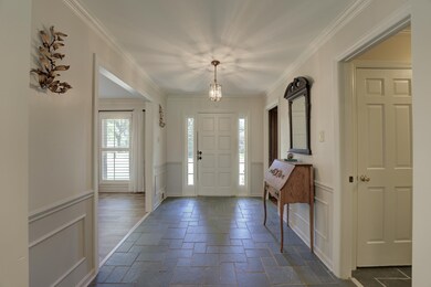 Office is to the right and Formal Dining to left.