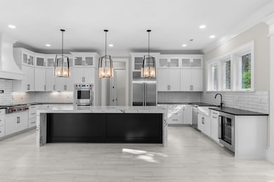 Kitchen featuring stainless steel appliances, a ce