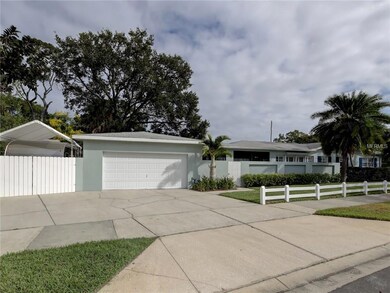 Side Entry Garage and Parking Pad