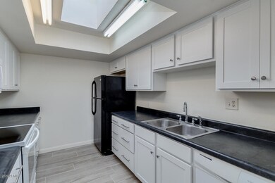 05-KITCHEN WITH WHITE SHAKER STYLE CABIN