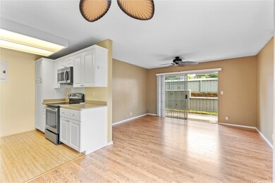 This open-concept layout connects the kitchen, din