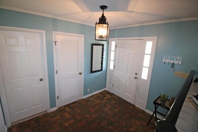 Foyer with brick paver floor