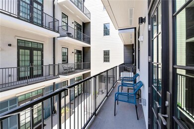 View from balcony to courtyard w/fountain