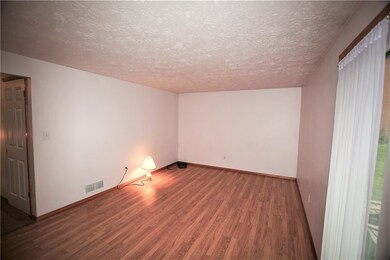 Living Room.  Newly installed laminate flooring