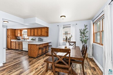 Dining area featuring dark wood-type flooring and 