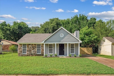 View of front facade featuring a chimney, concrete driveway, a porch, stone siding, and a gate