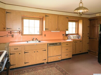 Kitchen with eat in area & door to mudroom &am