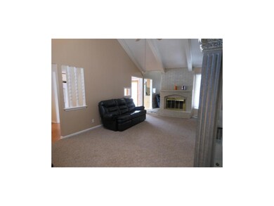 Spacious living room with tall vaulted ceilings