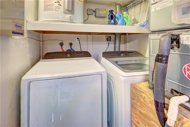 DOWNSTAIRS WASHER/DRYER AND AC/WATER TANK CLOSET
