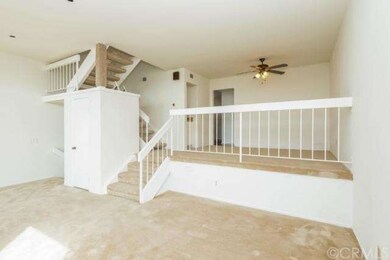 Dining room with ceiling fan and wet bar.