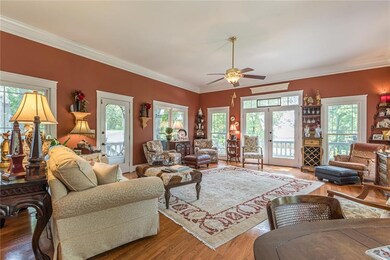 Living area with ornamental molding, french doors,