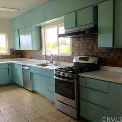 Stainless steel dishwasher, sink & stove.