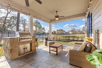 Look at this  charming outdoor patio with a built-