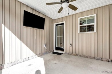Property entrance featuring ceiling fan and a pati