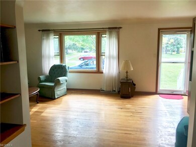 Hardwood floors in living room that offers tons of