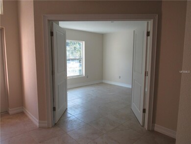 Front bedroom/office with double doors leading int