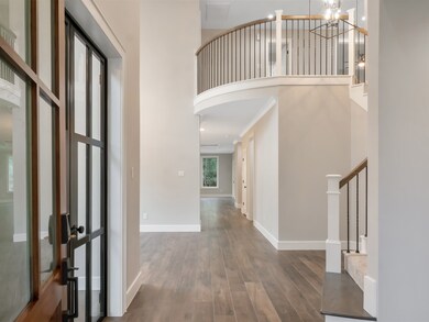 GRAND ENTRY WITH 2 STORY CEILINGS.